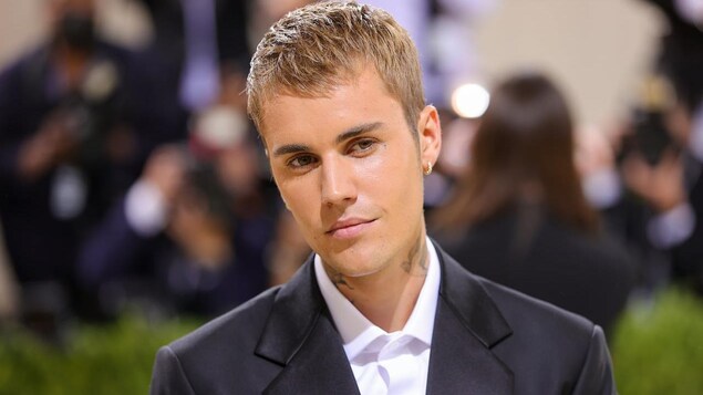 Justin Bieber attends The 2021 Met Gala Celebrating In America. The singer has criticized retailer H&M for releasing a collection that he says uses his face and lyrics without his approval. H&M says they followed all the proper procedures for licensed merchandise.