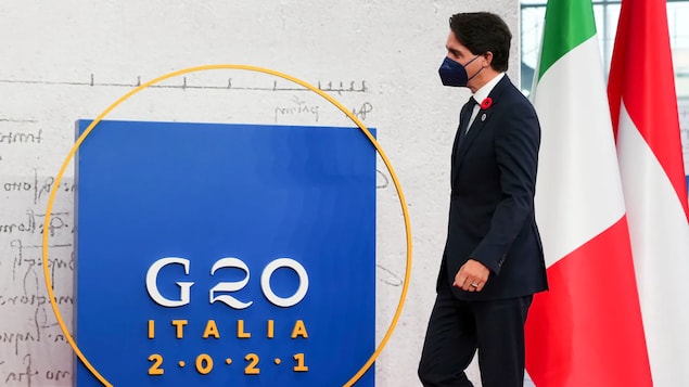 Prime Minister Justin Trudeau arrives at the G20 summit in Rome on Saturday. He issued a statement on Sunday about climate change, saying that 'we need to tackle this global crisis with urgency and ambition.'