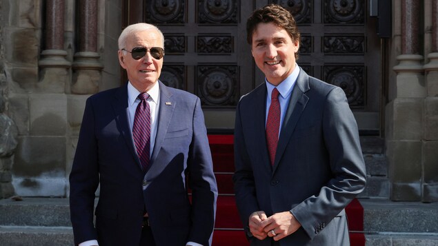 United States President Joe Biden poses with Prime Minister Justin Trudeau upon his arrival at Parliament.