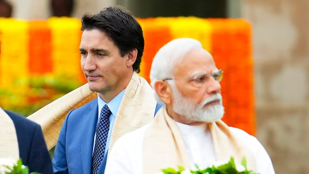 Prime Minister Justin Trudeau, left, walks past Indian Prime Minister Narendra Modi as they take part in a wreath-laying ceremony during the G20 Summit in New Delhi in September. 