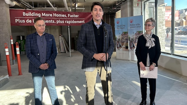 Wayne Long, MP for Saint John-Rothesay speaks as Prime Minister Justin Trudeau and Saint John Mayor Donna Reardon look on during a visit to The Wellington, a new inclusive housing project in Saint John, N.B. on Wednesday, Jan.17,2024. 