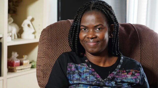 Kate Onakpo, who crossed at Roxham Road in 2017, now works as a caregiver in Montreal. (Charles Contant/CBC)