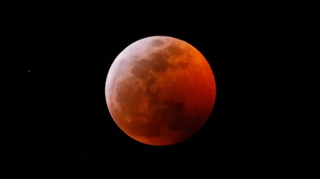 This photo shows the moon during the June 2019 total lunar eclipse. The eclipse taking place overnight between Thursday and Friday will be a near-total eclipse, meaning the Earth's shadow will be cast across most but not all of the moon's surface.