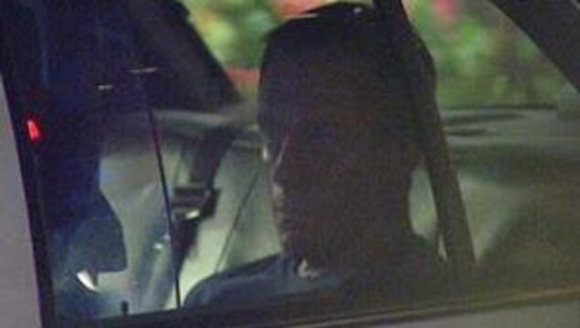 Photo de Michael Bryant dans une voiture de police Photo de Michael Bryant dans une voiture de police