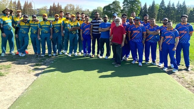 The Montreal Badshashs and Indian Stars pose for a photo from last weekend's season opening match. (Montreal Cricket Association/Facebook)