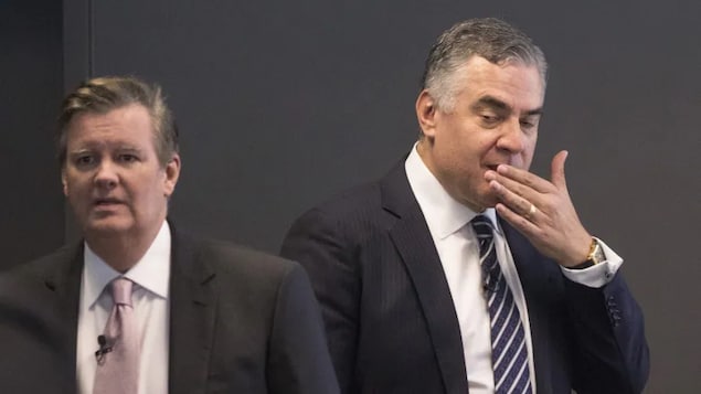 Rogers president and CEO Joe Natale, right, and chair of the board Edward Rogers are shown at the company's annual general meeting in 2019.