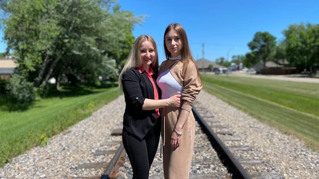 Karina Havina, right, fled Ukraine three weeks after Russia invaded on Feb. 24. She is now living with her aunt, Nelli Voloshanavskiy, left, in Altona, Man. Both women say they feel lucky to be living in a quiet, peaceful community, far from the horrors of war.