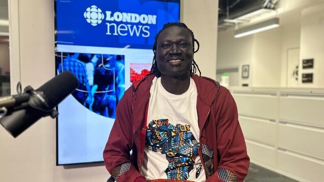 Nhial Deng, 24, is studying global studies and communications at Huron University College in London, Ont. (Travis Dolynny/CBC)