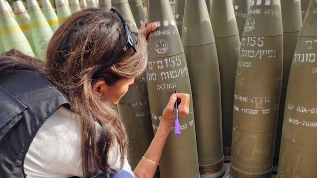 This photo, provided by the office of Israeli lawmaker Danny Danon, shows Nikki Haley signing an Israeli artillery shell while touring Israel’s northern border with Lebanon on Tuesday. Haley's visit comes as Israel faces heightened criticism for not doing enough to protect civilians in Gaza amid its war against Hamas. 