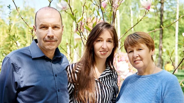Oksana Grygorieva, centre, poses with her parents, Leonid Kubatin, left, and Iryna Kubatina, in Kharkiv in 2019. Grygorieva, who lives in Toronto, helped her parents apply to the Canadian government's temporary residence program for Ukrainians fleeing the war. Three months later, they're still waiting to hear back. (Submitted by Oksana Grygorieva)