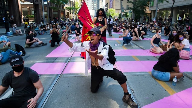 Protesters calling attention to anti-Black racism and police brutality demonstrated around the world last summer, including in Toronto, as shown here on June 19, 2020. 