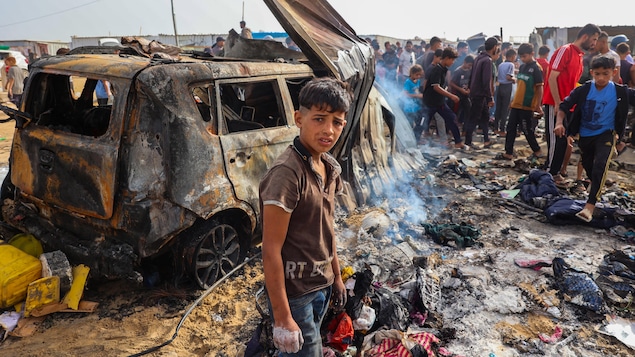 Palestinians gather at the site of an Israeli strike on a camp area housing internally displaced people in Rafah on May 27, amid ongoing battles between Israel and Hamas. Advocates say government restrictions and media self-censorship mean the realities of the Gaza war go largely unseen in Israel. 