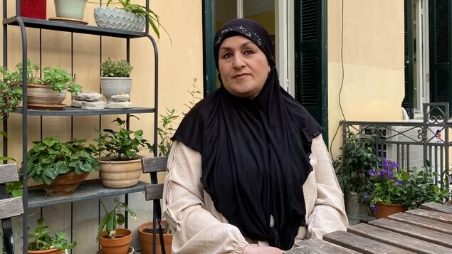 Parwin Hamkar, a former prosecutor in Kabul, was evacuated to Greece along with hundreds of Afghan women in positions of authority shortly after the Taliban came to power in August 2021. She's pictured at the Melissa Network in Athens on Wednesday, May 17, 2023. (Romain Chauvet/CBC)