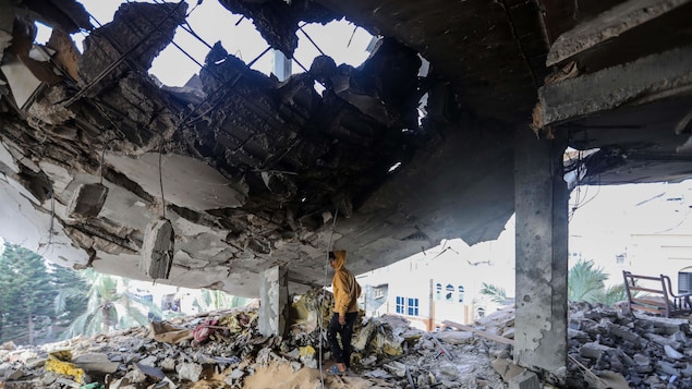 A Palestinian inspects the damage after Israeli airstrikes on February 10, 2024 in Rafah, Gaza.