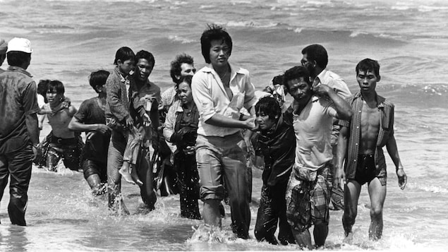 A picture taken in the late 1970s shows a group of refugees who arrived in Malaysia on a small boat that sank a few metres from shore. The flight of Vietnamese refugees began after the fall of Saigon in 1975. In spite of the dangers of unfriendly waters and piracy, tens of thousands took the South China Sea. By 1978, the exodus had grown to dramatic proportions.