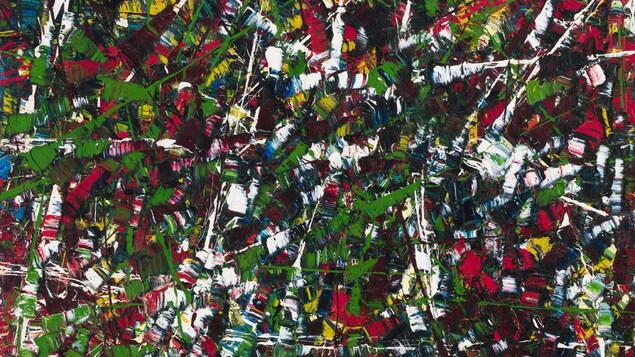 Une toile avec de nombreuses couleurs vives entremêlées.
