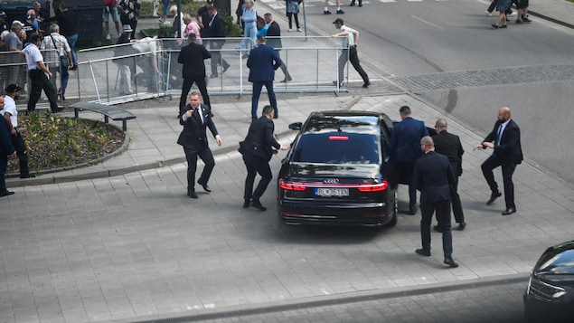 Security officers move Slovak Prime Minister Robert Fico in a car after a shooting following a government meeting in Handlova on Wednesday. 