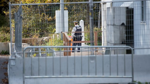 An officer behind a barrier.