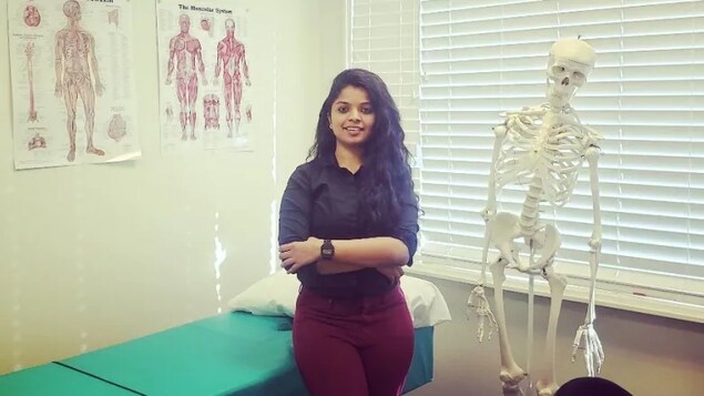 Sampada Keluskar at her job as an interim physiotherapist at a walk-in clinic in Grande Prairie, Alta. 