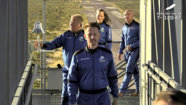 Star Trek actor William Shatner rings a bell before boarding Blue Origin's New Shepard rocket on mission NS-18 for a suborbital flight near Van Horn, Texas in a still image from video October 13, 2021.