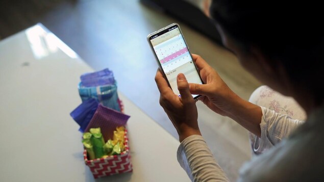 Some legal and privacy experts in the U.S. are concerned that women's period tracking apps could be used, alongside other information, to prosecute them for having an illegal abortion. Here, a woman uses a period tracking app in Madrid on May 16.