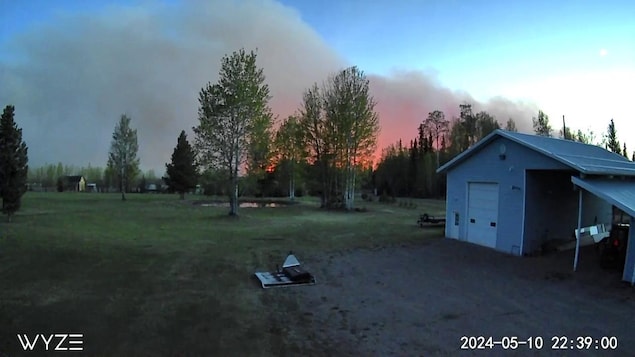 The smoke from the Parker Lake wildfire is seen from a surveillance camera in Fort Nelson, B.C., on May 10.