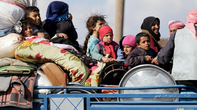 Des civils syriens évacués. Des civils syriens évacués.