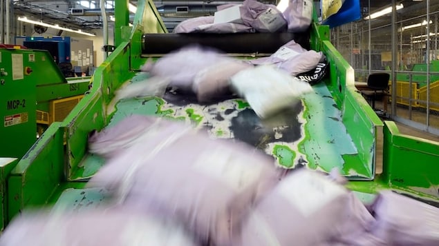 Parcels slide down a ramp after being scanned at the U.S. Customs and Border Protection overseas mail inspection facility at Chicago's O'Hare International Airport in February 2024 in Chicago. 