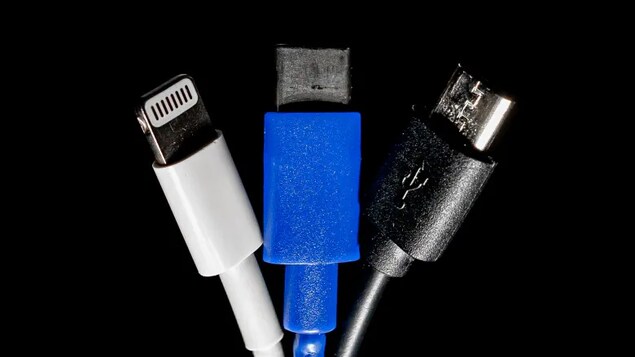 About one in five phones in Europe use Apple's Lightning port, shown here on the left, while the rest use a version of USB, two versions of which are shown at centre and on the right. (Craig Chivers/CBC)
