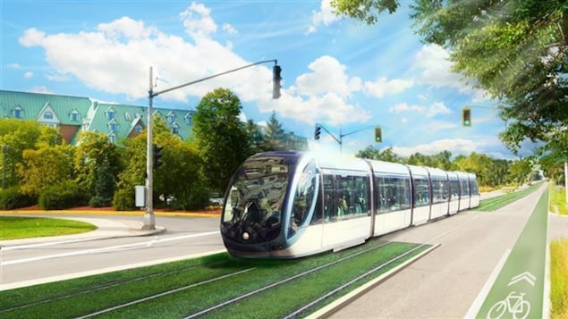 Le train circule sur un des deux côtés de la voie routière.