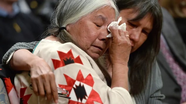 Residential school survivor Lorna Standingready is comforted by a fellow survivor during the closing ceremony of the Truth and Reconciliation Commission, at Rideau Hall in Ottawa on June 3, 2015.