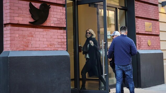 Twitter employees are seen entering the offices in New York City earlier this month. The company shut down its offices until Monday as staff decided whether to stay on or quit. (Brendan McDermid/Reuters)