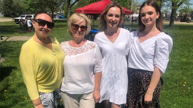 Volunteer Margaret Reznikof along with Ukrainian refugees Mariia Danyliuk, Tatiana Chorna and Anastasia Chorna who arrived in Windsor, Ont. less than a week ago after fleeing their home in Mykolaiv, in southern Ukraine. (Jacob Barker/CBC)