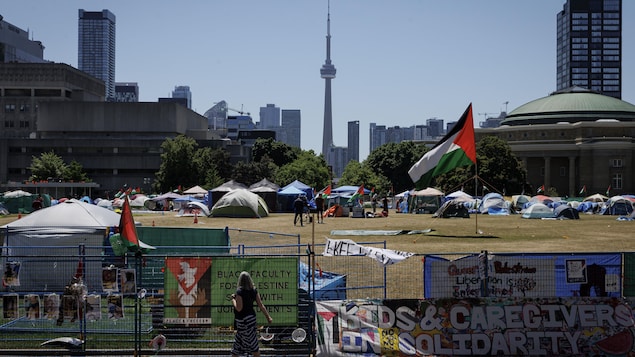Occupants of a pro-Palestinian encampment on the main campus of the University of Toronto are pictured on May 24, 2024 — the day a deadline to dismantle is set to expire. 
