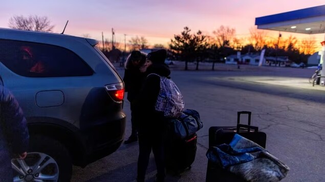 Some of the people who got off buses from New York City to Plattsburgh, N.Y. in the hours after the deadline before strict new border rules in Canada decided to try their luck at Roxham Road anyway. (Carlos Osorio/REUTERS)
