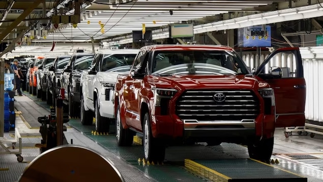 Tundra trucks and Sequoia SUVs roll off the assembly line at the Toyota plant in San Antonio, Texas, earlier this year. Even as they fear the effects of climate change, Canadians keep buying large vehicles and the gas to fuel them. (Jordan Vonderhaa/Reuters)
