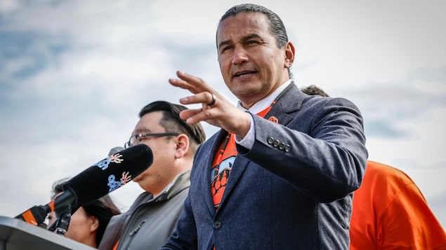 Premier Wab Kinew speaks during an event at the Brandon Residential School site on Sept. 30. 