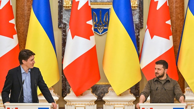 During a surprise visit to Ukraine, Prime Minister Justin Trudeau, left, attends a news conference with Ukrainian President Volodymyr Zelensky after their meeting in Kyiv, Ukraine's capital, on Sunday.