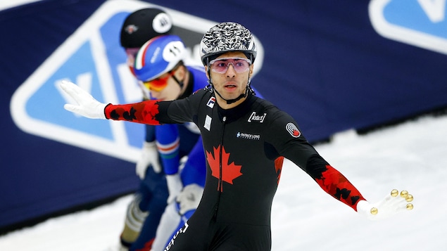 William Dandjinou écarte les bras après sa course.