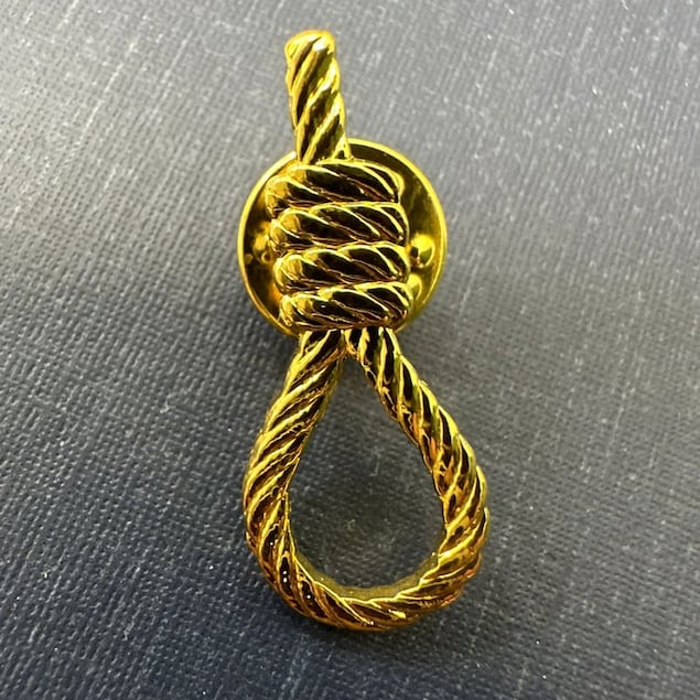 A close-up of the noose lapel pin worn by far right members of the Israeli Knesset to hearings on the proposed death penalty bill.