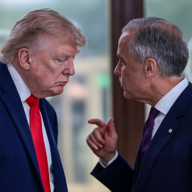 Prime Minister Mark Carney, right, speaks with U.S. President Donald Trump at a luncheon with leaders of the G7, in Évian-les-Bains, France, on June 16. 
