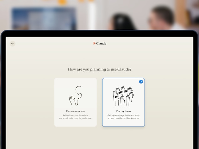 A computer screen displaying a conversational robot by the name of Claude, in an office.  ai can train books without