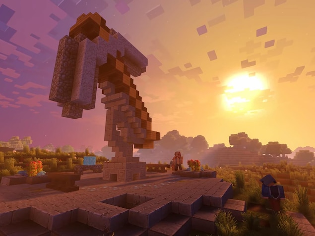 Une capture d'écran montrant un coucher de soleil dans Minecraft.