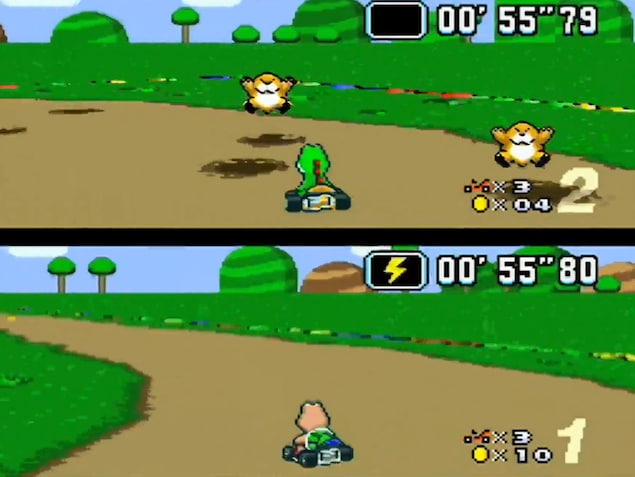 Deux joueurs de Super Mario Kart s'affrontent sur l'écran partagé. Deux joueurs de Super Mario Kart s'affrontent sur l'écran partagé.