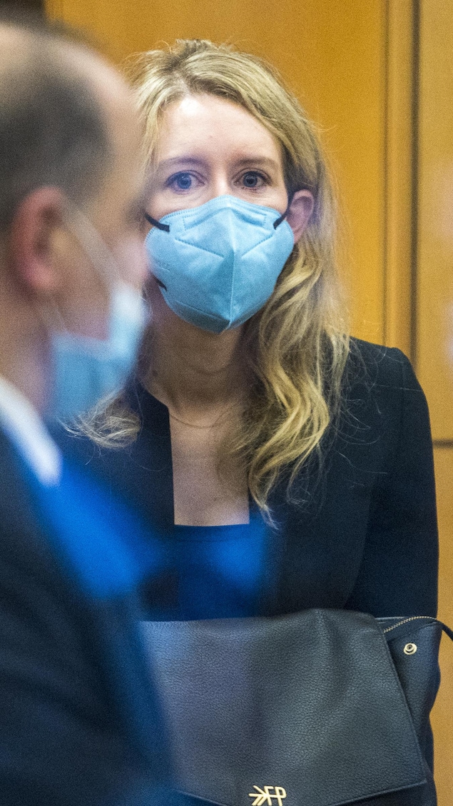 FILE - Elizabeth Holmes walks into federal court in San Jose, Calif., on Dec. 16, 2021. A federal judge on Friday, Nov. 28, 2022, will decide whether disgraced Theranos CEO Holmes should serve a lengthy prison sentence for duping investors and endangering patients while peddling a bogus blood-testing technology. (AP Photo/Nic Coury, File)