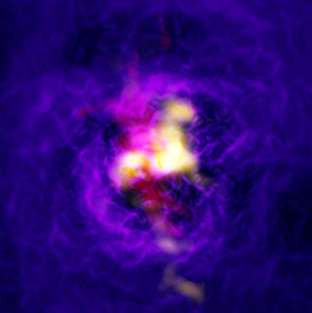 Sur cette image composite de l’amas de galaxies Abell 2597 figure le flux de gaz s’échappant du trou noir supermassif situé au cœur de la galaxie centrale. Sur cette image composite de l’amas de galaxies Abell 2597 figure le flux de gaz s’échappant du trou noir supermassif situé au cœur de la galaxie centrale.