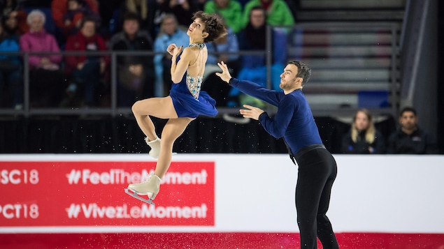 Eric Radford (à droite) lance sa partenaire, Meagan Duhamel, dans les airs pour une figure de leur programme libre. Eric Radford (à droite) lance sa partenaire, Meagan Duhamel, dans les airs pour une figure de leur programme libre.