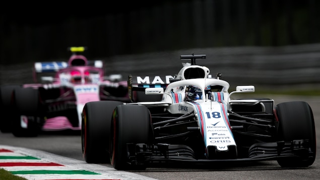 Lance Stroll roule devant Esteban Ocon à Monza. Lance Stroll roule devant Esteban Ocon à Monza.