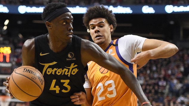 Toronto Raptors forward Pascal Siakam (43) moves around Phoenix Suns forward Cameron Johnson (23) during second half NBA basketball action in Toronto on Friday, Feb. 21, 2020. THE CANADIAN PRESS/Frank Gunn