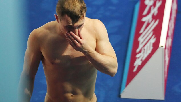 Déception dans le visage de Jack Laugher après son dernier plongeon.